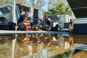 image of a BVHVAC technician working on system