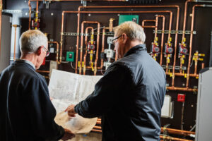 image of a BVHVAC technician working on system