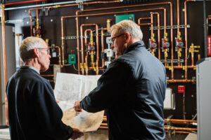 image of a BVHVAC technician working on system