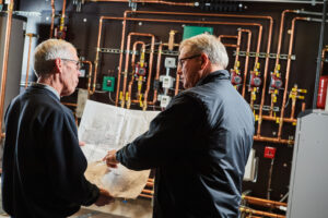 image of a BVHVAC technician working on system