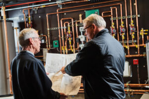 image of a BVHVAC technician working on system