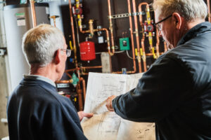 image of a BVHVAC technician working on system