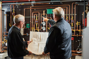 image of a BVHVAC technician working on system
