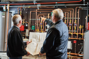 image of a BVHVAC technician working on system