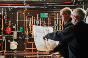 image of a BVHVAC technician working on system