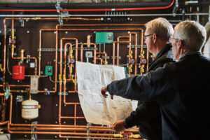 image of a BVHVAC technician working on system