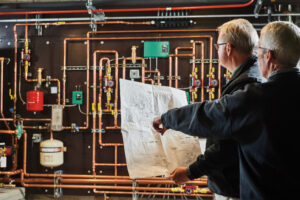 image of a BVHVAC technician working on system