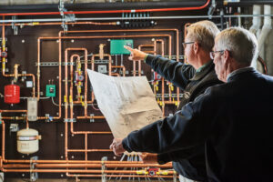 image of a BVHVAC technician working on system