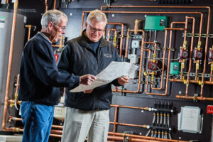 image of a BVHVAC technician working on system