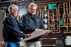 image of a BVHVAC technician working on system