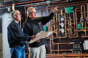 image of a BVHVAC technician working on system