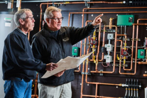 image of a BVHVAC technician working on system