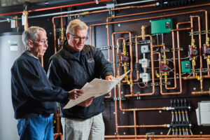 image of a BVHVAC technician working on system