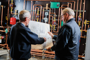image of a BVHVAC technician working on system
