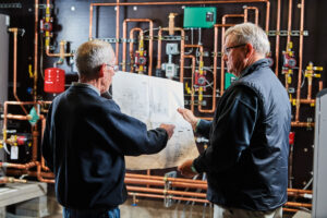 image of a BVHVAC technician working on system