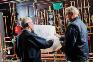 image of a BVHVAC technician working on system