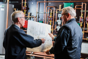 image of a BVHVAC technician working on system