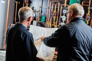 image of a BVHVAC technician working on system