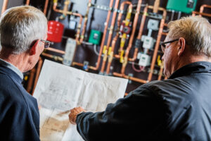 image of a BVHVAC technician working on system