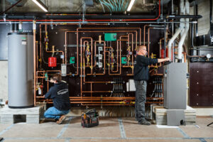 image of a BVHVAC technician working on system