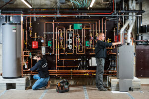 image of a BVHVAC technician working on system