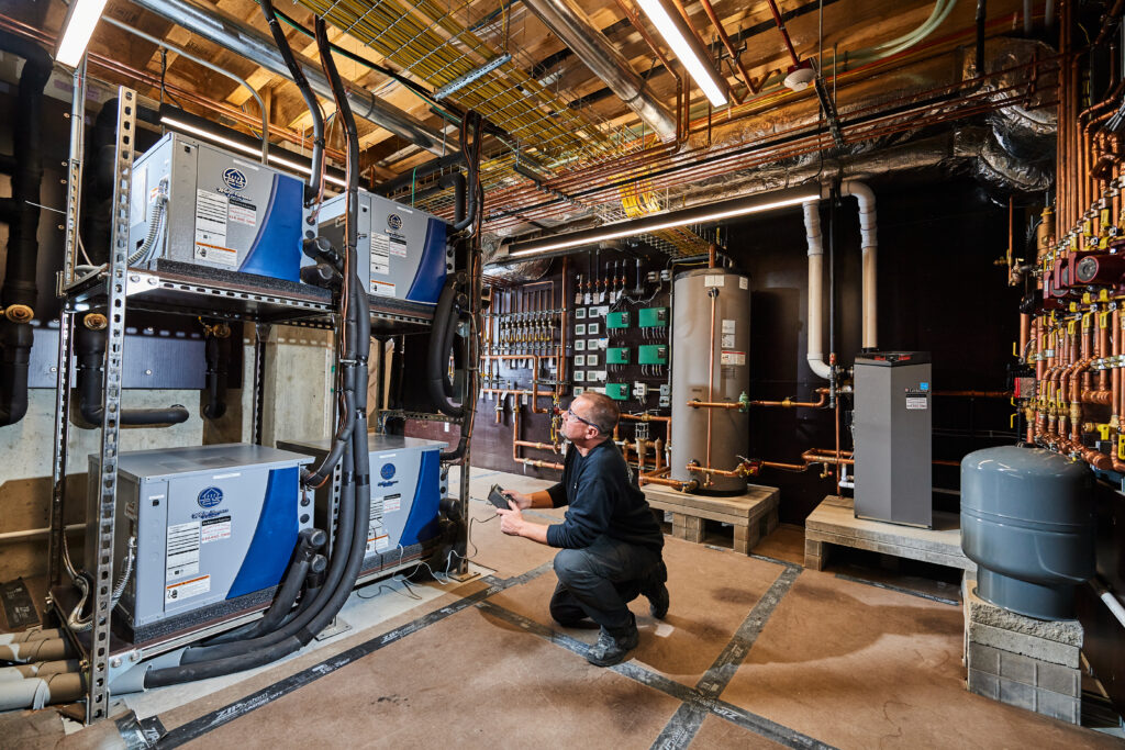 image of a BVHVAC technician working on system