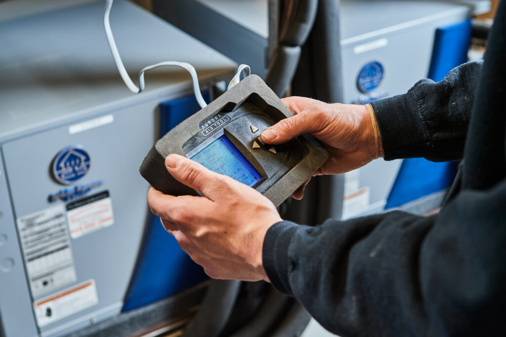 image of a BVHVAC technician working on system