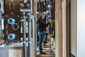 image of a BVHVAC technician working on system