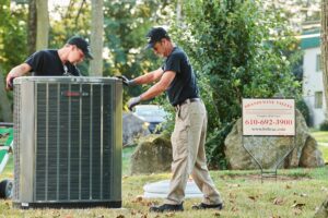 image of a BVHVAC technician working on system