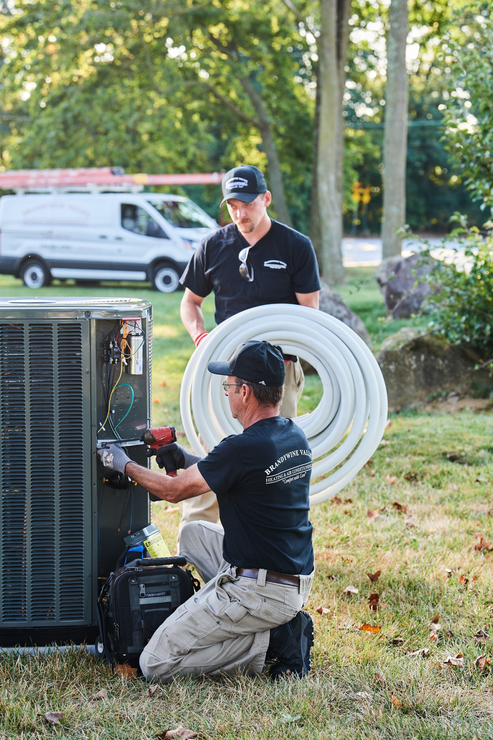 image of a BVHVAC technician working on system