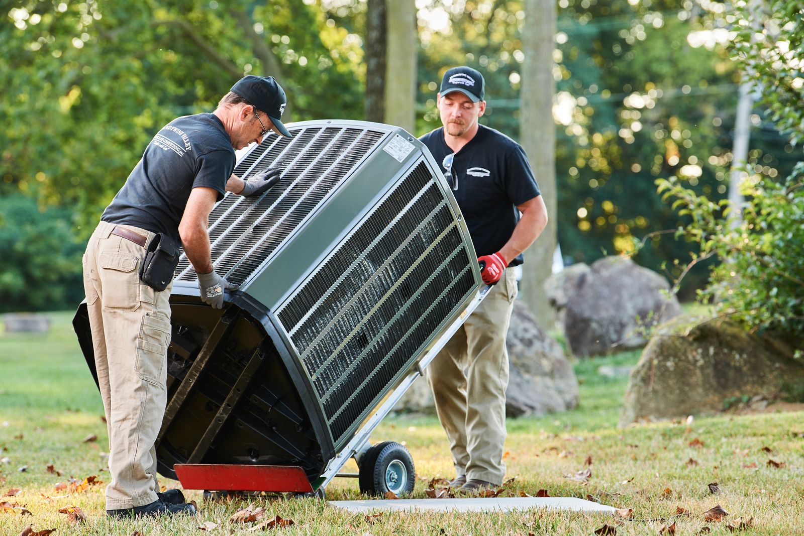 image of a BVHVAC technician working on system