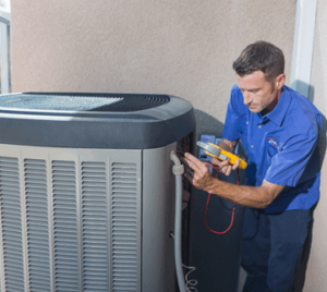 image of a BVHVAC technician working on system