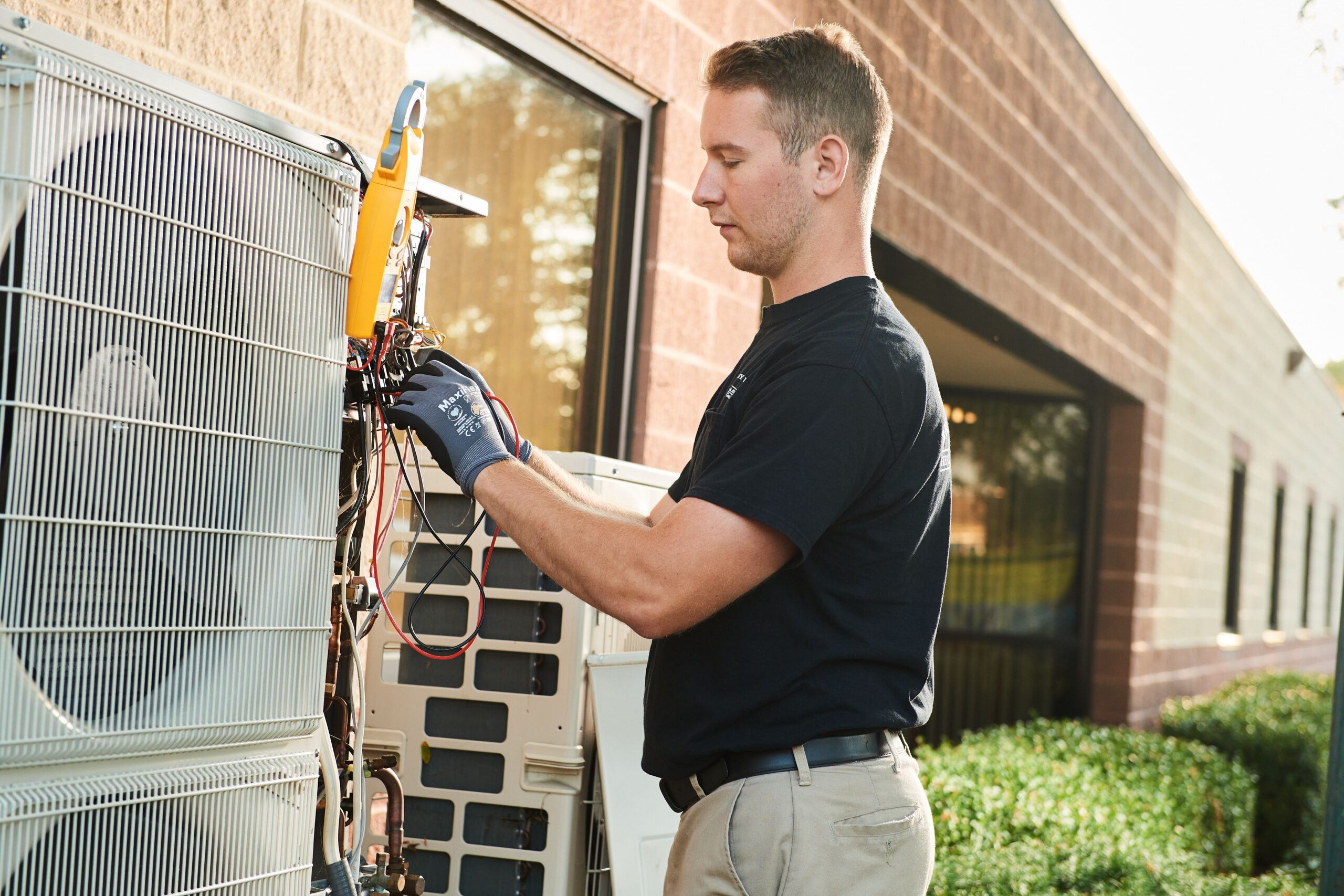 Service 3 - Home air conditioning repair image of a BVHVAC technician working on system
