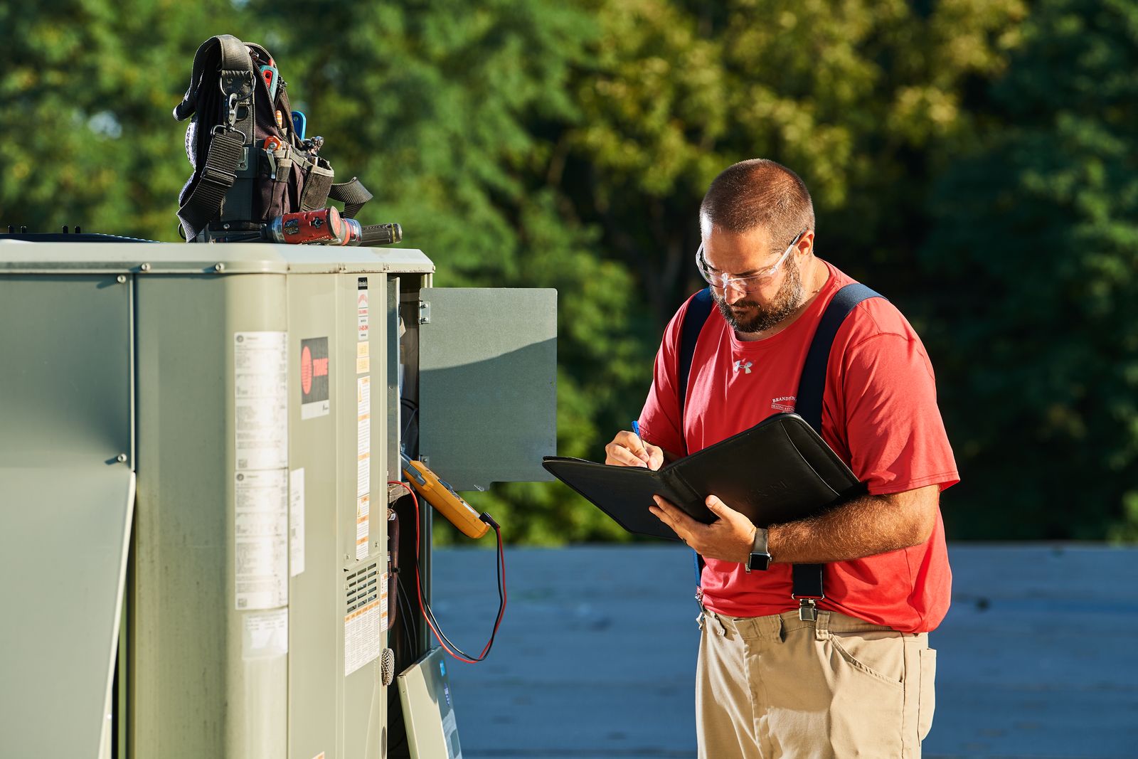 image of a BVHVAC technician working on system