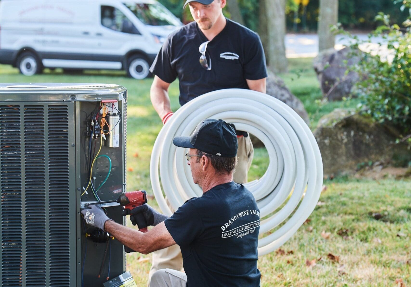 image of a BVHVAC technician working on system