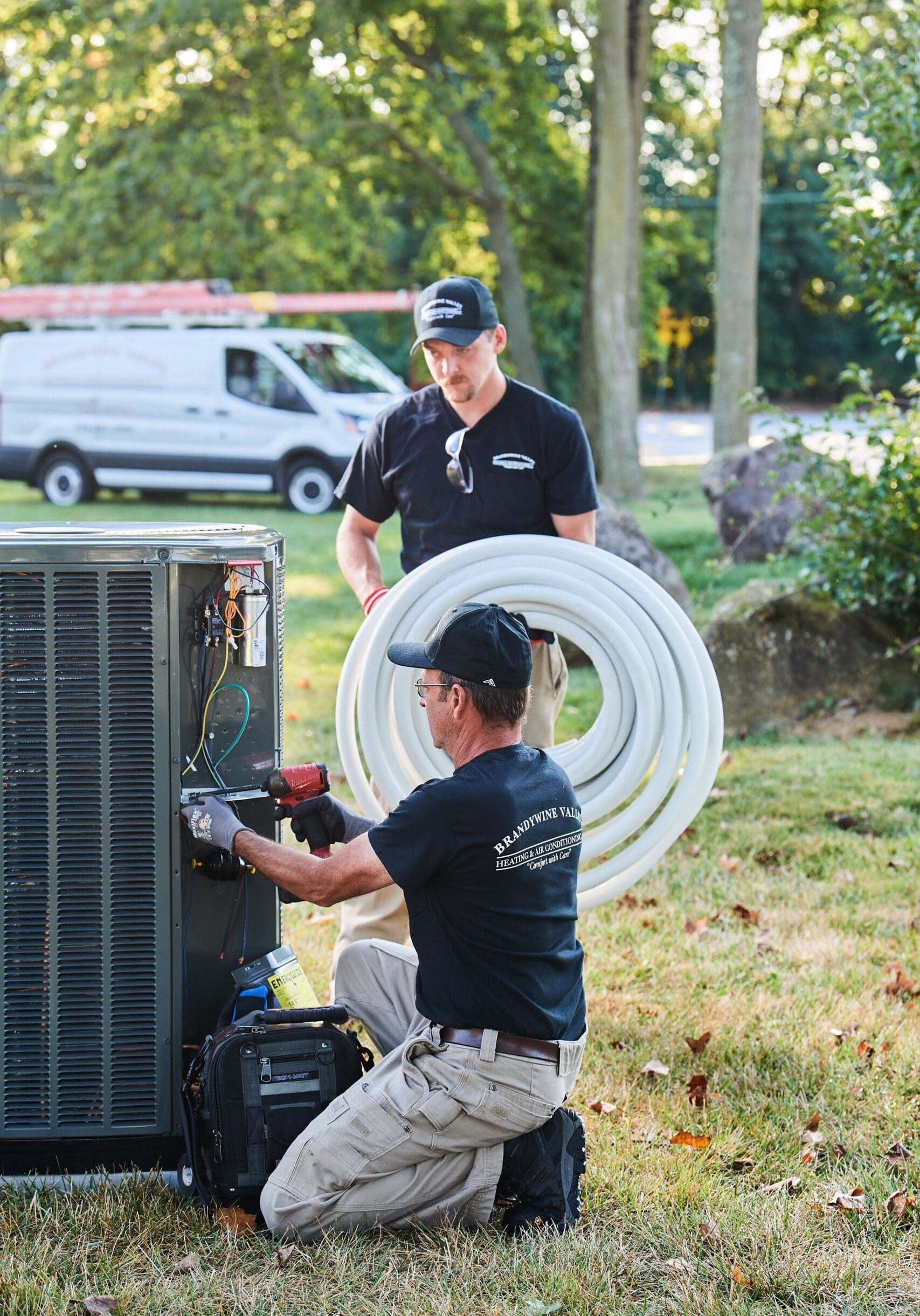 image of a BVHVAC technician working on system
